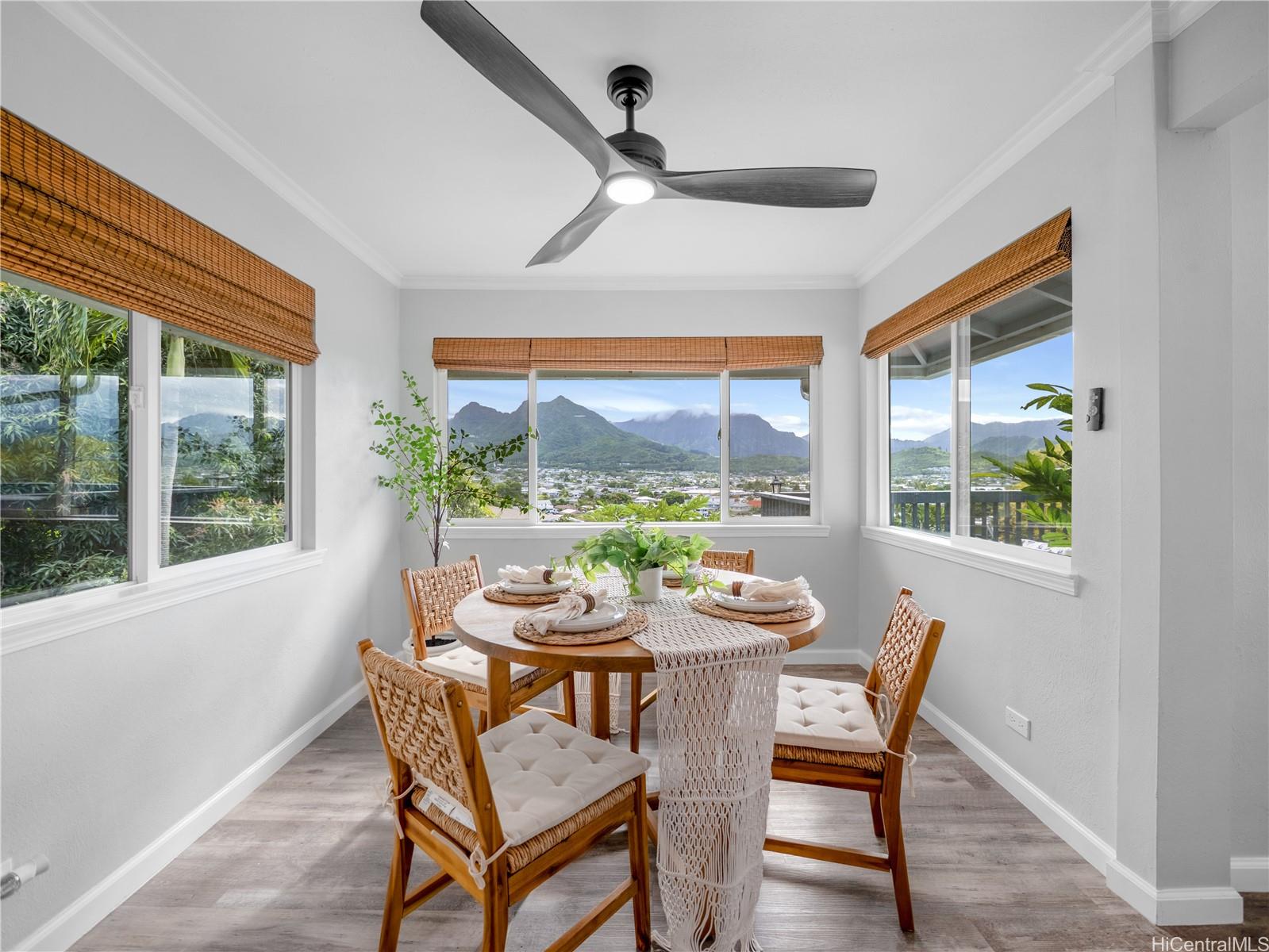 Sunlit dining nook framed by mountain views