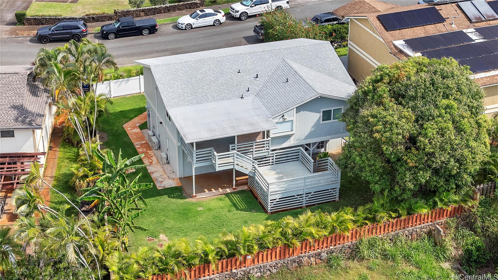 Aerial view of the home, deck and landscaped yard