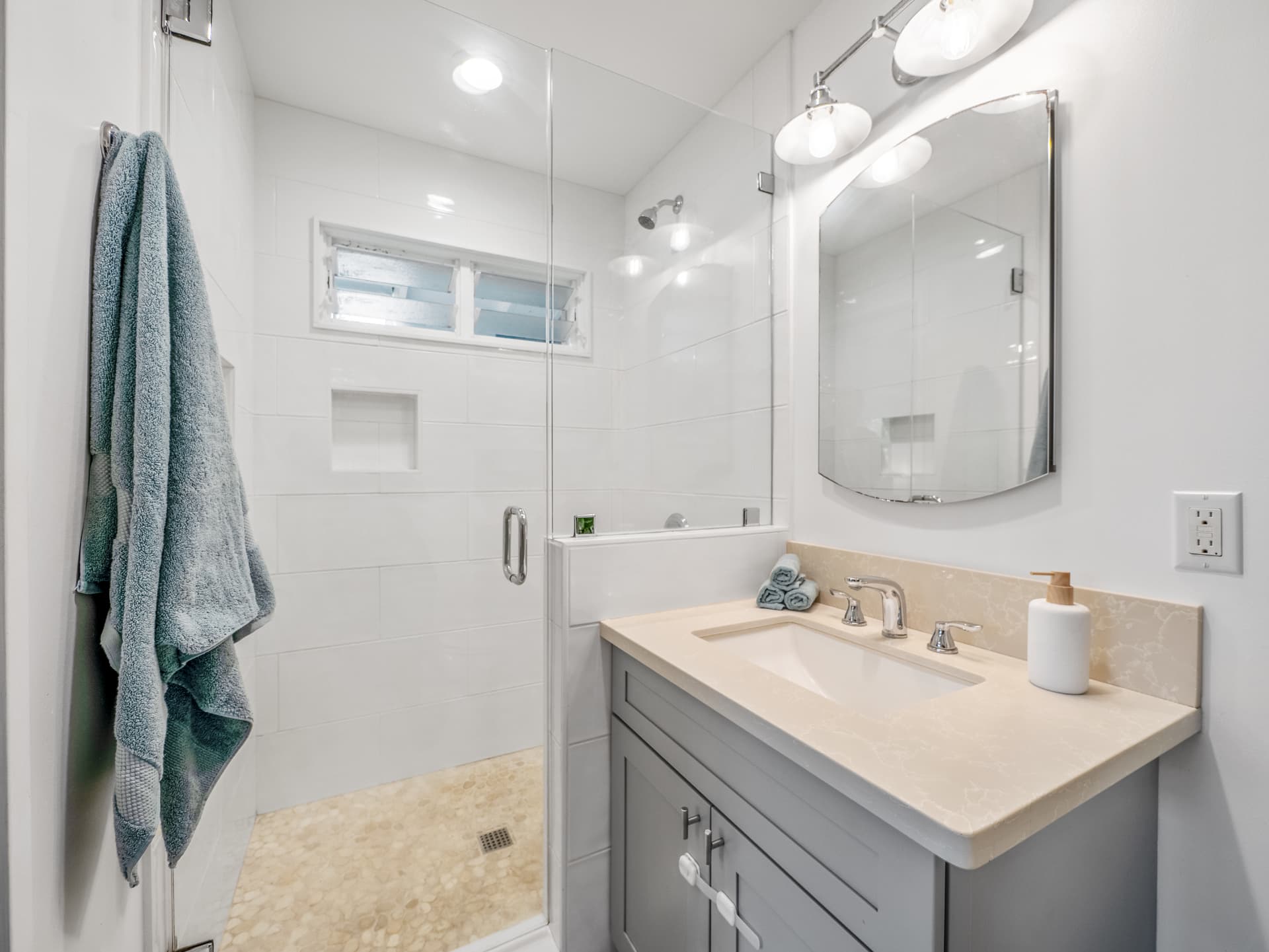Updated bathroom with glass walk-in shower and vanity