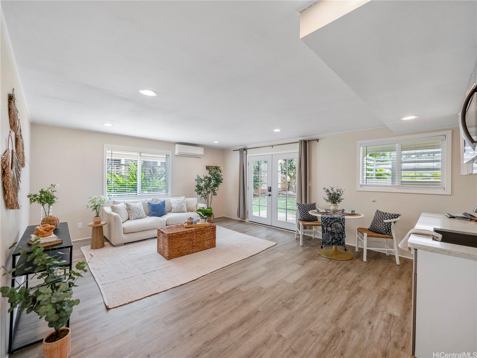 Downstairs living space with French doors to the yard