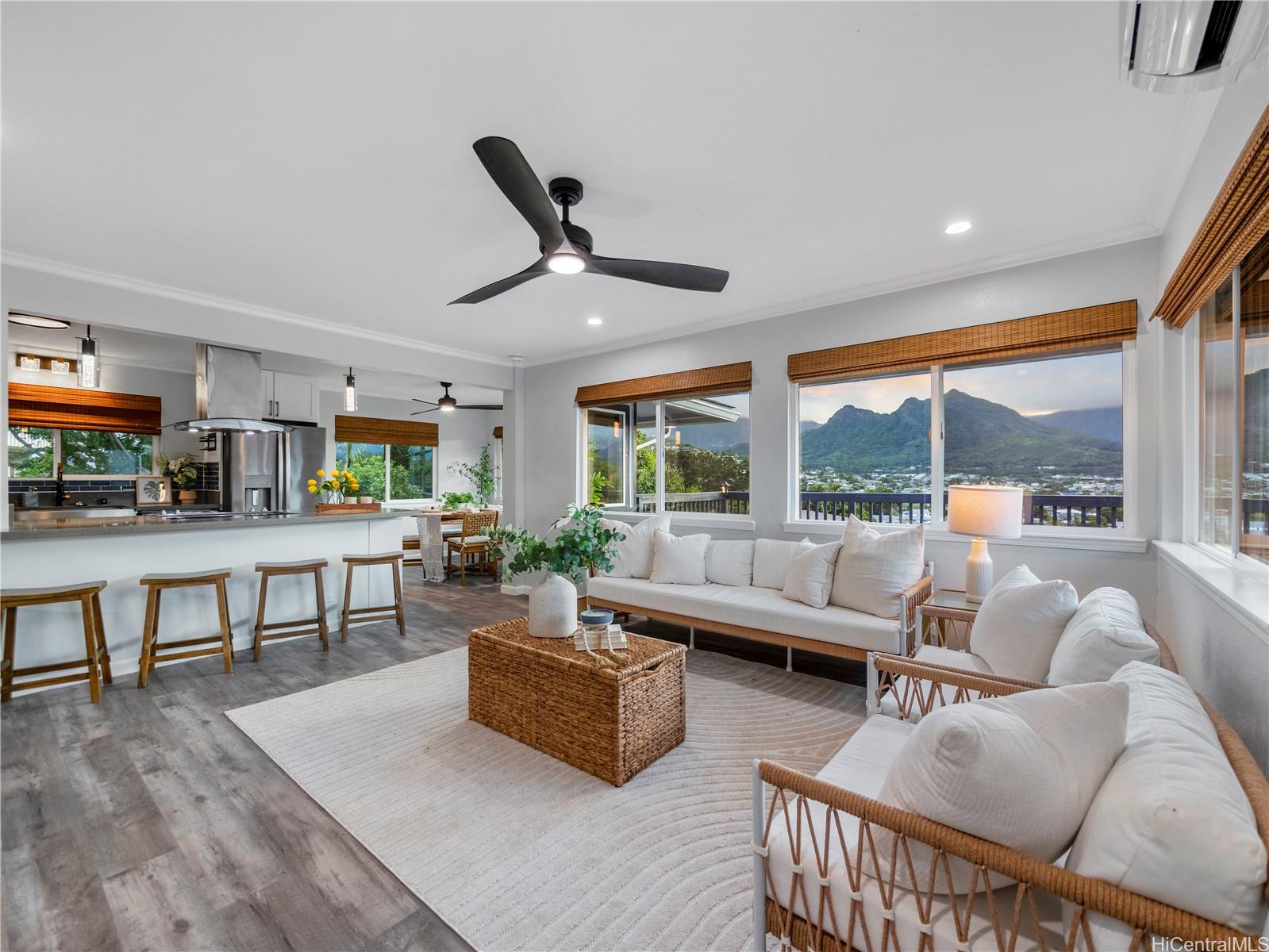 Open living room with mountain views and kitchen bar seating