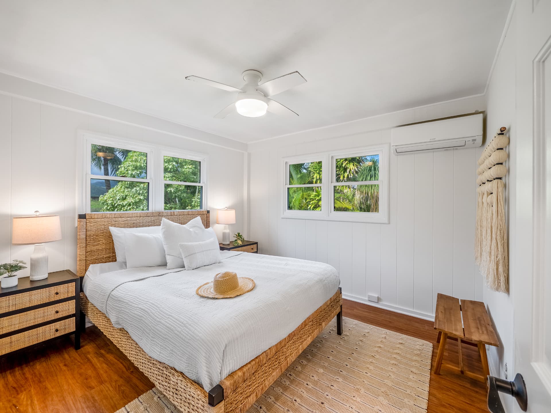 Bedroom with woven bed frame and coastal styling