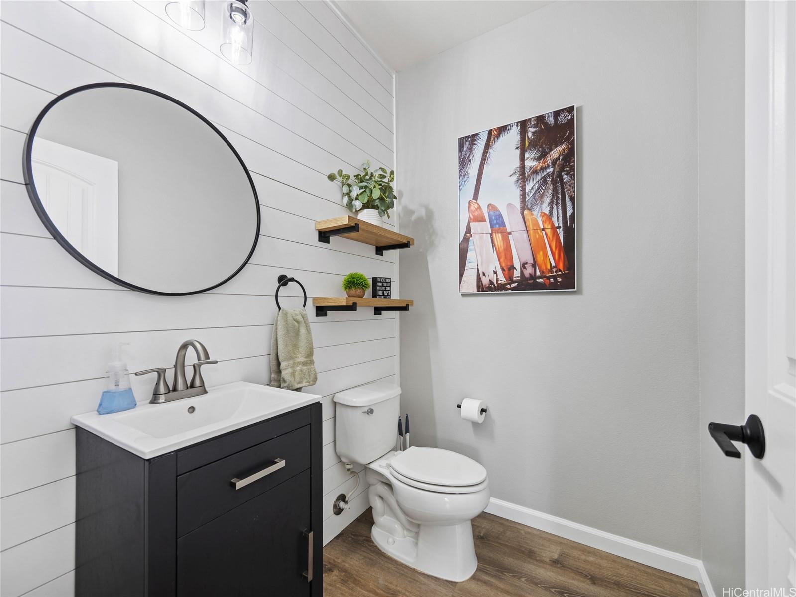Modern half bath with shiplap wall