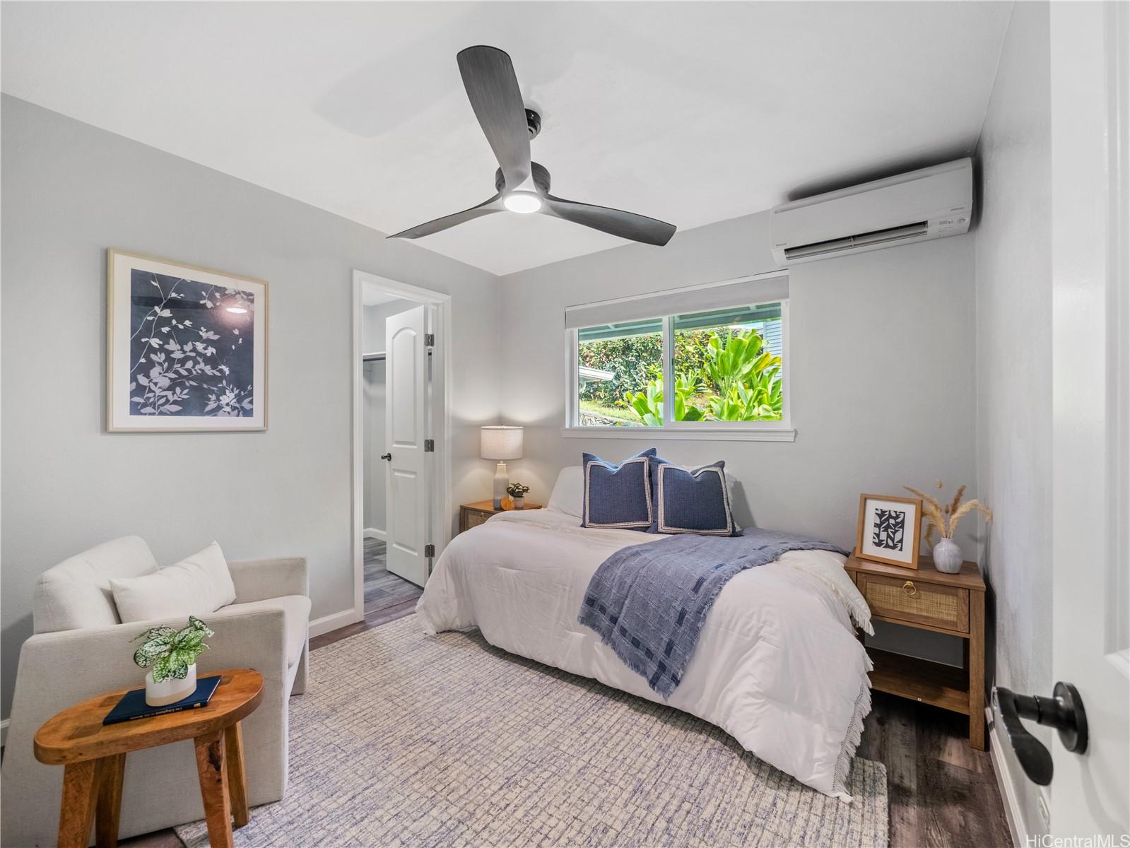 Guest bedroom with garden views and sitting area