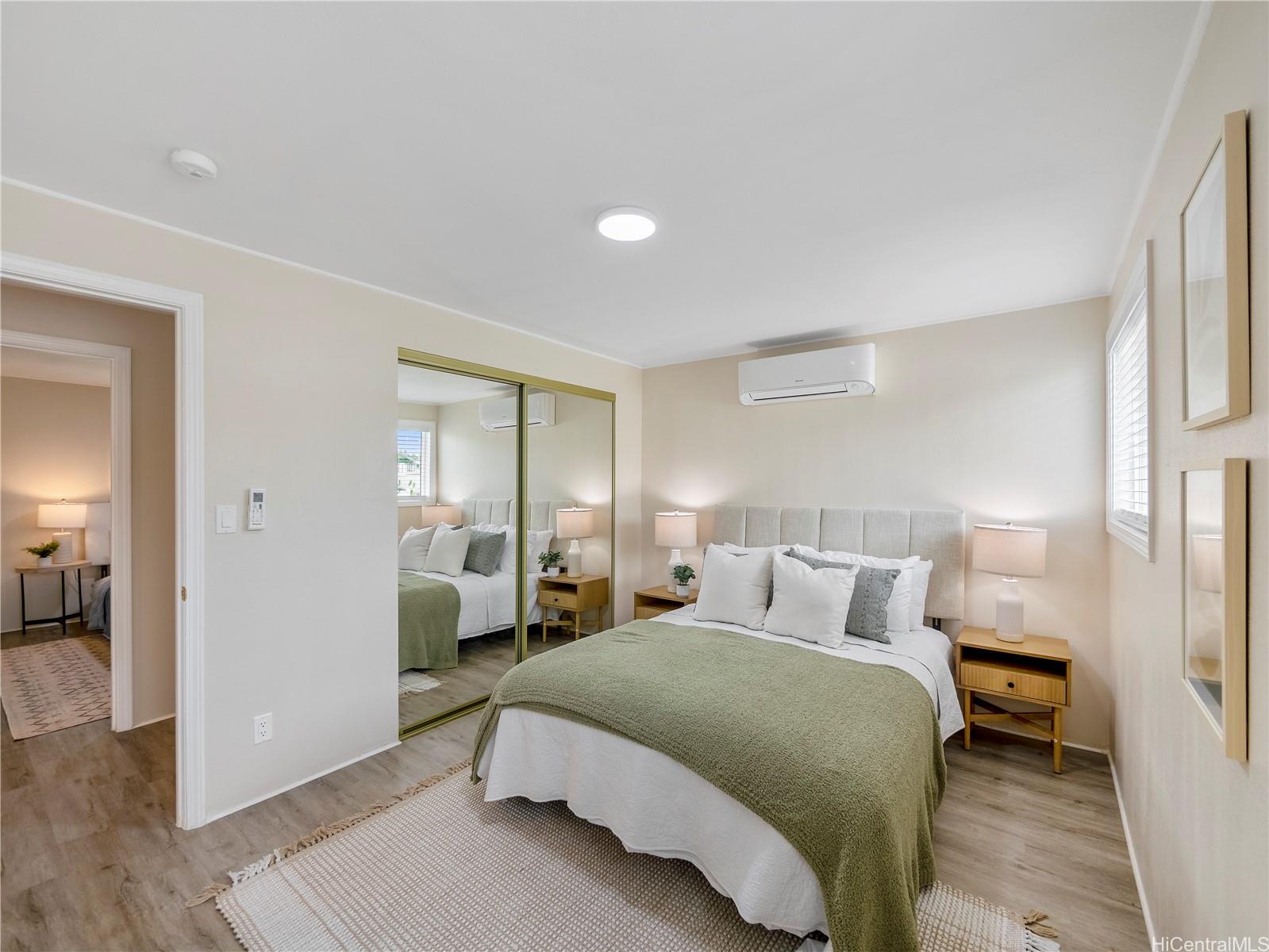 Additional bedroom with mirrored closet and split AC